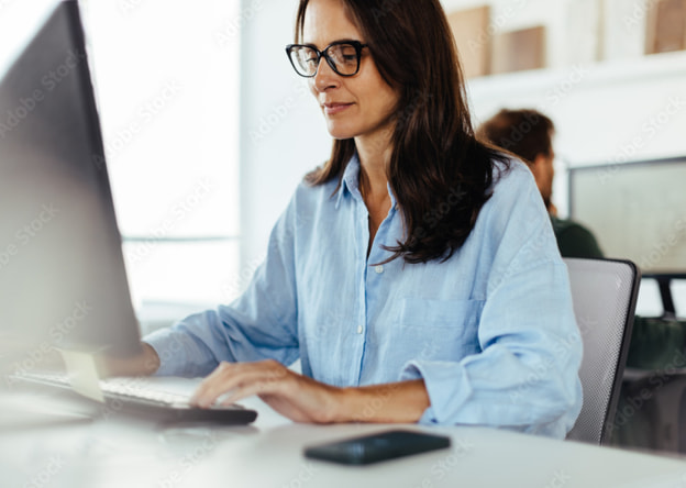 Woman taking the LPI assessment on a desktop computer.